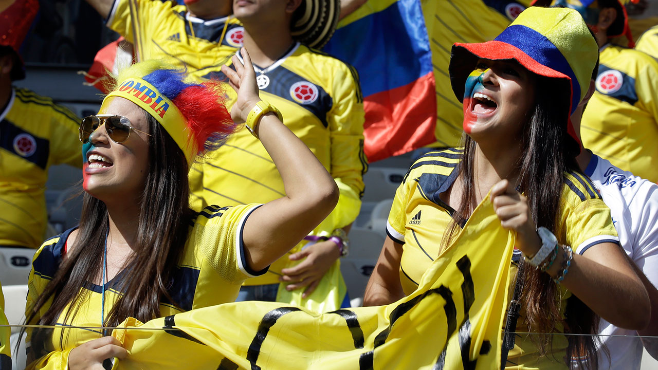 Columbian fans cheer before their group C World Cup soccer match between Colombia and Greece at the Mineirao Stadium in Belo Horizonte, Brazil, Saturday, June 14, 2014.