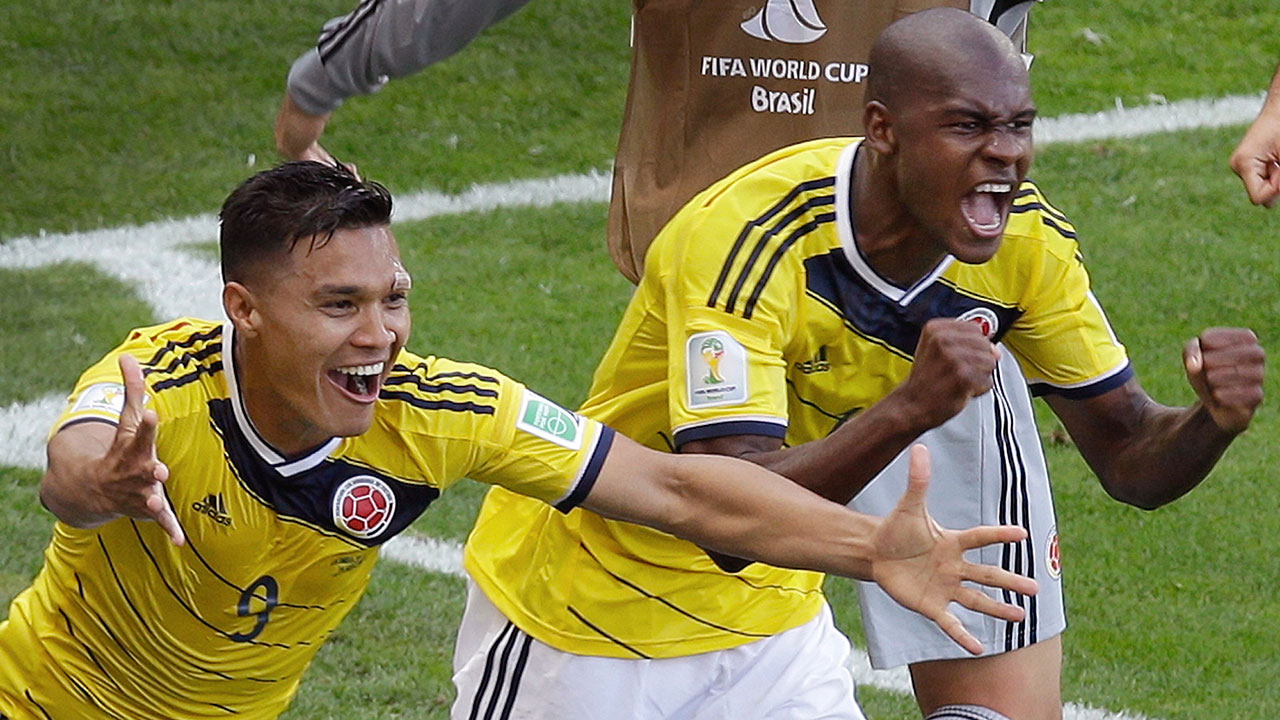 Colombia’s Teofilo Gutierrez (9) celebrates with teammate Victor Ibarbo after scoring during their Group C World Cup match against Greece in Belo Horizonte, Saturday, June 14, 2014.