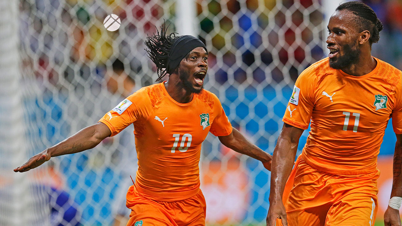 Ivory Coast's Gervinho (10) celebrates with teammate Didier Drogba (11) after Gervinho scored his side's second goal during the match between Ivory Coast and Japan in Recife, Brazil, Saturday, June 14, 2014.