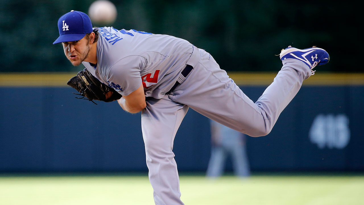 Los Angeles Dodgers starting pitcher Clayton Kershaw throws against the Colorado Rockies. (Jack Dempsey/AP)