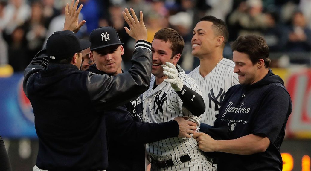 With help of reversal, Yankees beat A's in extra innings